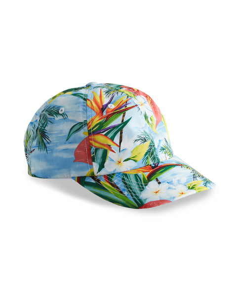 Image shows front view Paradise Snapback. Pattern depicts tropical foliage and blue sky. 