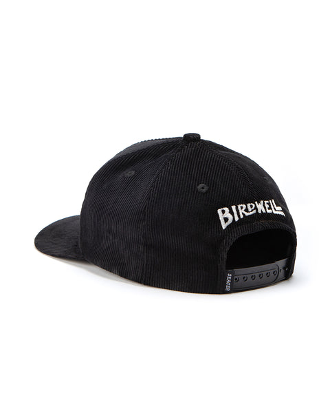 Image shows front of Roping Birdie Snapback in Black. Embroidered Birdwell wordmark sits above the adjustment strap.
