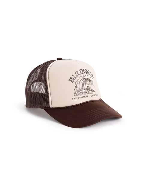 3/4 view of the hat. Front Panel is tan with a brown birdwell graphic of birdie surfing with the text 