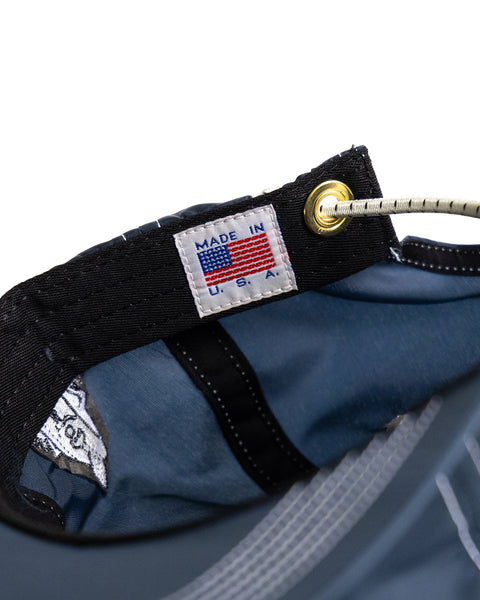 Detail shot showing made in usa tag on interior of hat. Features WHR Shock Cord Bungee closure.
