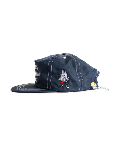 Side view of Navy WHR hat with Western Hydronamic Research embroidered in white. Birdie embroidered on left side of hat. Features WHR Shock Cord Bungee closure.