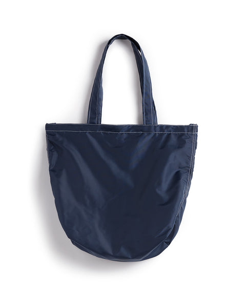 Back of tote bag in navy. White contrast stitching.