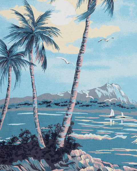 The Postcard Beach Towel depicts a blue Hawaiian landscape illustration from Hoffman Fabrics. Close up detail image.