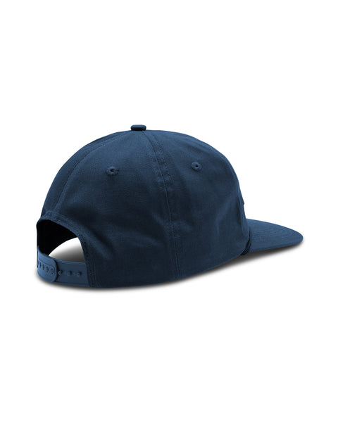 The Service Snapback in Blue, with plastic snap and visor rope detail. Back angle.